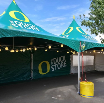 Custom logo canopy tent with printed walls, branded promotional event tent for festivals, trade shows, and corporate marketing.