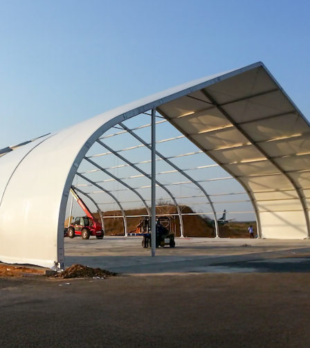 Large clear-span commercial tent structure for storage, logistics, or industrial use.