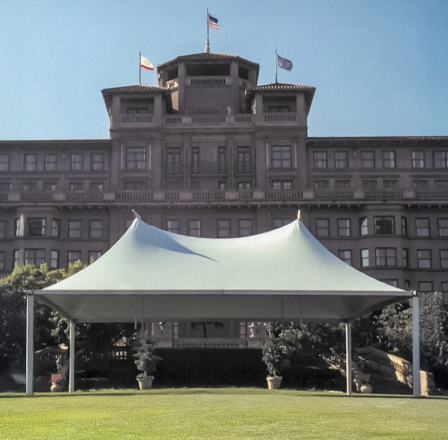Commercial large event tent with high peaks for formal outdoor gatherings.