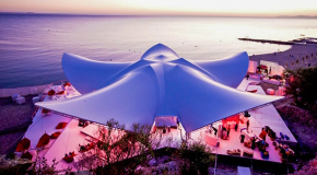 Architectural large event tent used for premium outdoor celebrations.