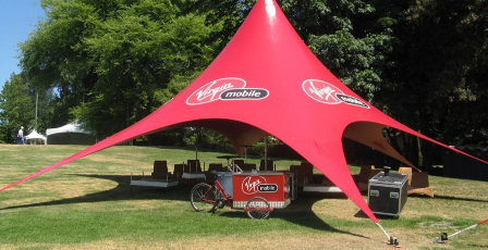 Custom logo event tent with tensioned canopy, branded promotional structure for corporate marketing, festivals, and experiential campaigns.