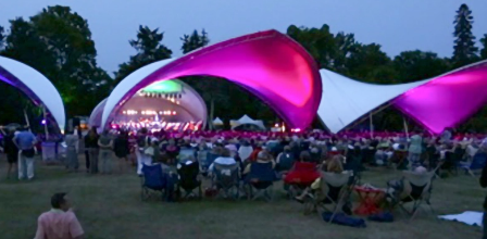 Modern large event tent used for outdoor concerts and public gatherings.