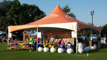 Custom branded event tent providing high-visibility shelter and engagement space for corporate outdoor events.