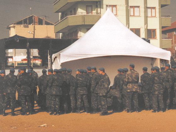 people lined up outside an Emergency Tent