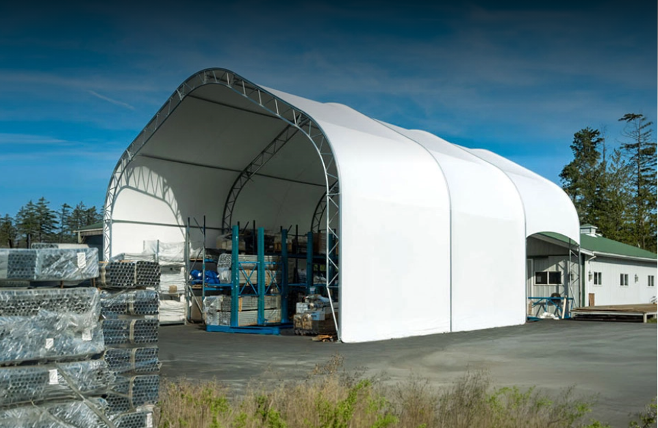 Large commercial fabric building used for industrial storage