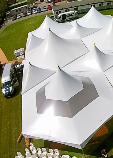 Aerial view of a large white engineered event tent