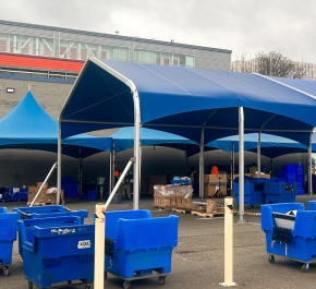 Blue industrial fabric structure at commercial facility